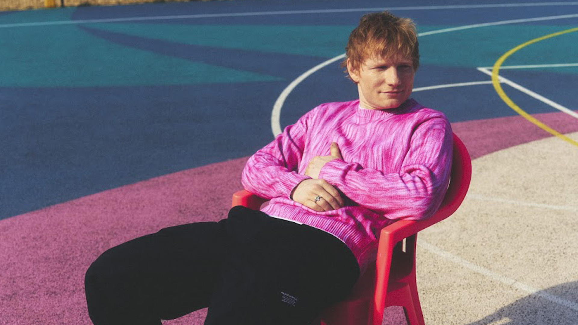 Ed Sheeran wearing a pink jumper